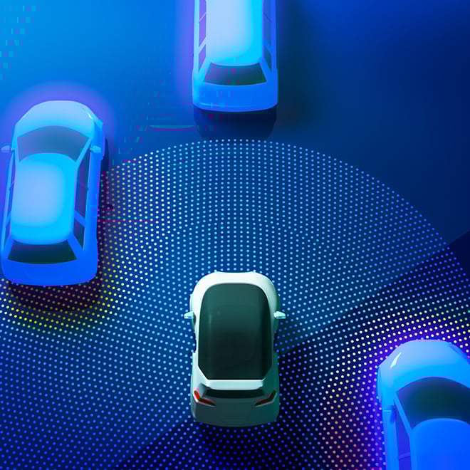 Futuristic self-driving cars using sensors to detect proximity, highlighting the need for high-density, low-latency AI infrastructure for autonomy.
